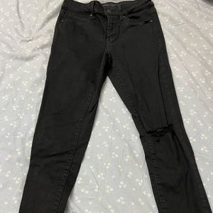 Black ripped knee skinny jeans